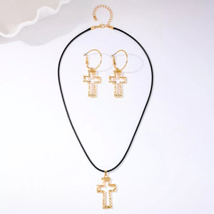 Golden cross pendant necklace and hoop earrings set with textured detail