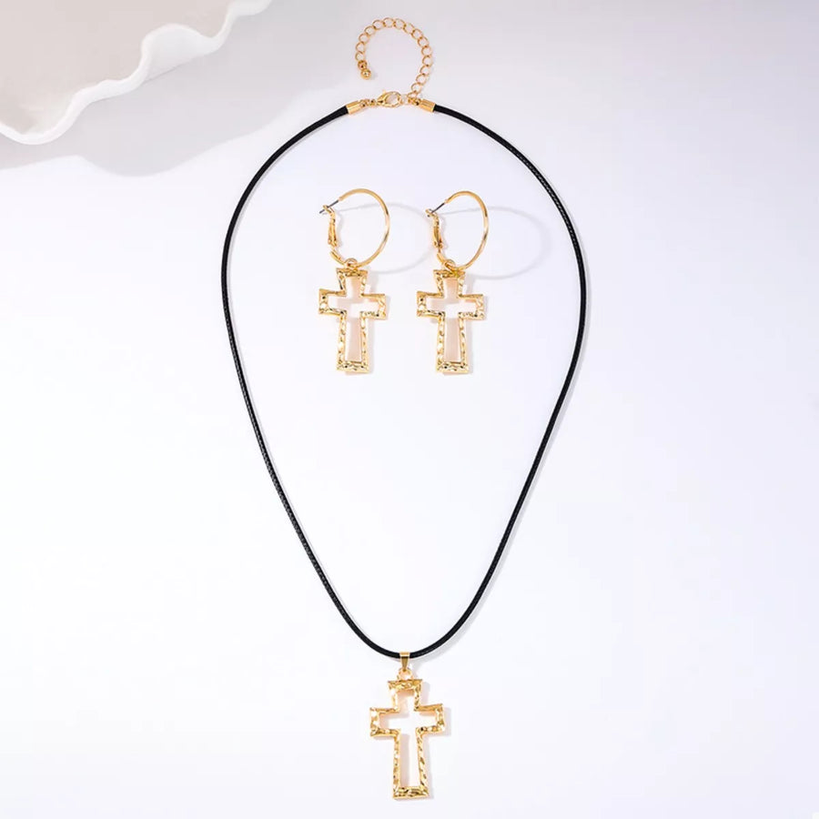 Golden cross pendant necklace and hoop earrings set with textured detail