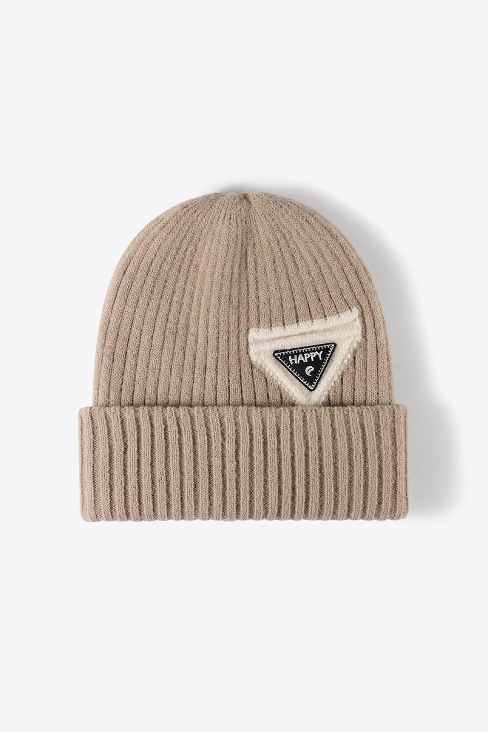 Beige ribbed acrylic beanie with a triangular patch that says HAPPY
