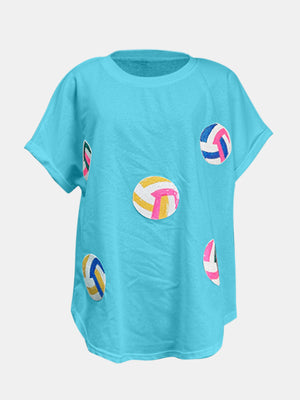 Sky blue t-shirt with scattered sequin volleyball graphics and rolled sleeves.