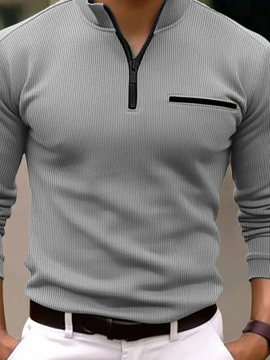 Gray ribbed quarter-zip sweatshirt with black zipper and chest pocket detail.