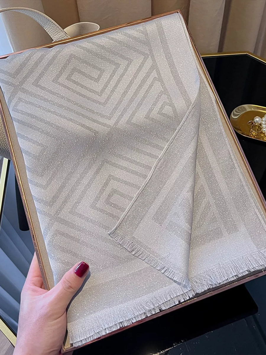 Elegant Tencel cotton scarf in beige with geometric pattern and fringe detail