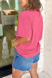 Pink cotton mineral wash tee with short sleeves and a crew neck, styled with denim shorts.