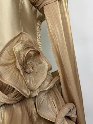 Gold ruffled mini dress with corset waist and ruched sleeve detail.