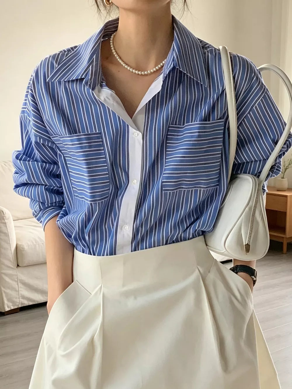 Pink button-down shirt with hip-length and button-front