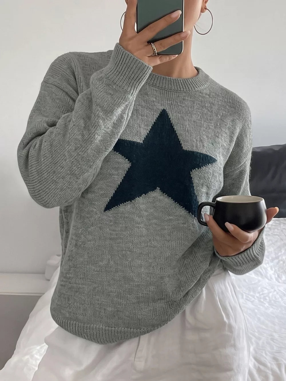 navy blue pullover sweater featuring dropped shoulder and geometric