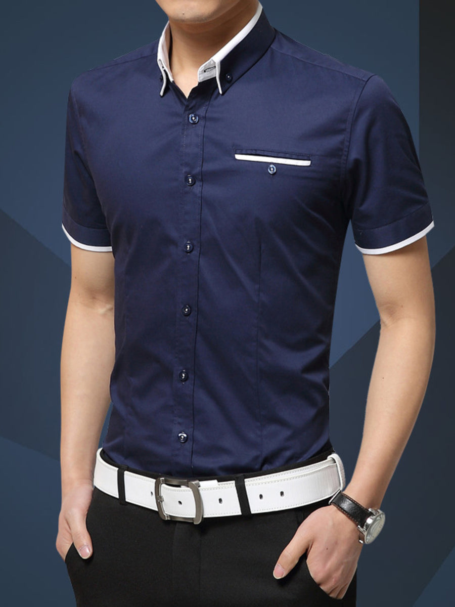 button-up shirt in navy blue featuring buttoned and fitted fit