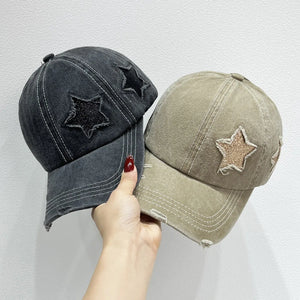 Stellar snapback cap in gray and khaki with distressed stars and stitching.