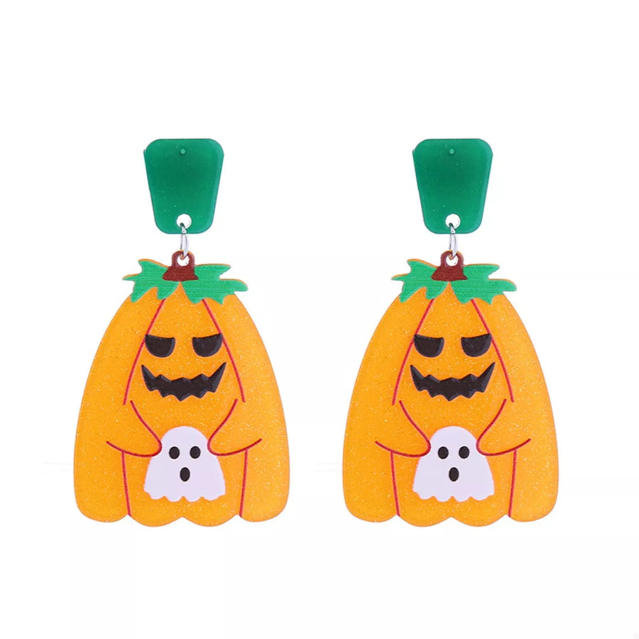 Spooky dangle earrings with orange pumpkins holding white ghosts, green tops.