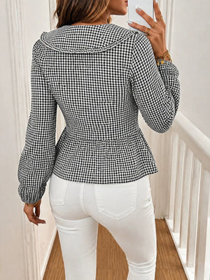 100% polyester Care instructions: Machine wash cold peplum top in Black with fitted silhouette