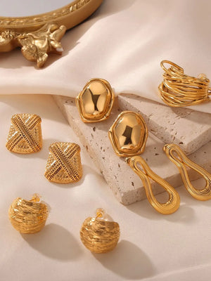Sculptural gold-tone earrings collection featuring abstract, woven, and geometric styles.