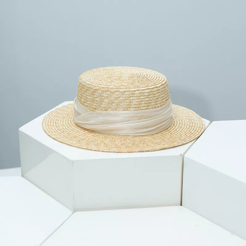 Elegant straw boater hat in tan with sheer ribbon trim