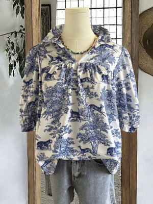 Toile de Jouy half sleeve blouse with a collared neckline and gathered details.