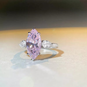 silver ring featuring marquise cut stone and geometric