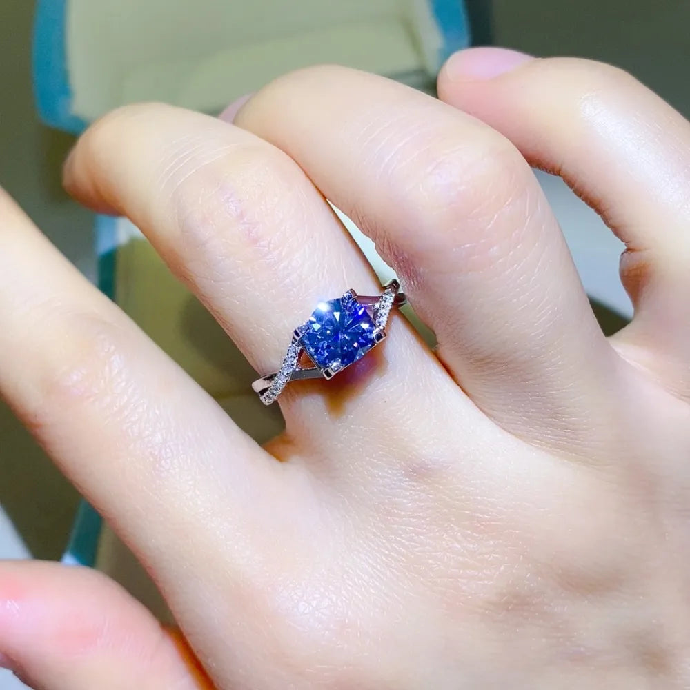 Silver twisted ring with blue pavé moissanite engagement stone