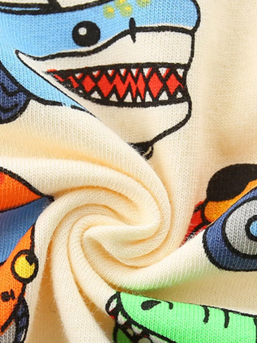 Cream cotton toddler t-shirt with cartoon vehicle print, featuring a shark vehicle.