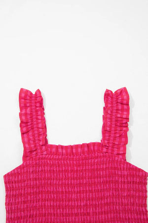 Smocked sundress with ruffled straps in deep rose gingham cotton.