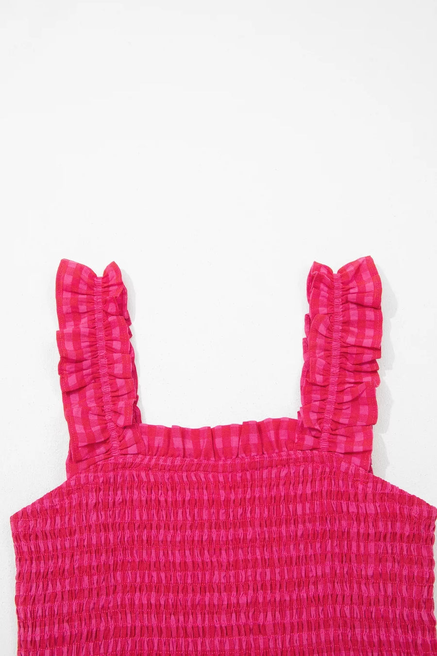 Smocked sundress with ruffled straps in deep rose gingham cotton.