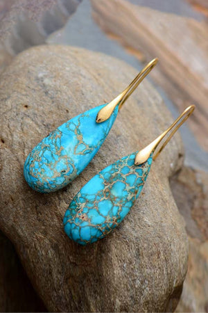 Teardrop Jasper drop earrings in gold/blue with natural stone texture.