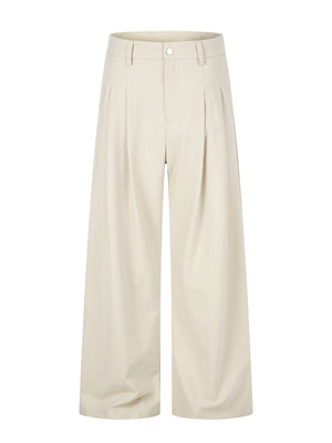 wide-leg pants in cream featuring pleated front and wide-leg fit