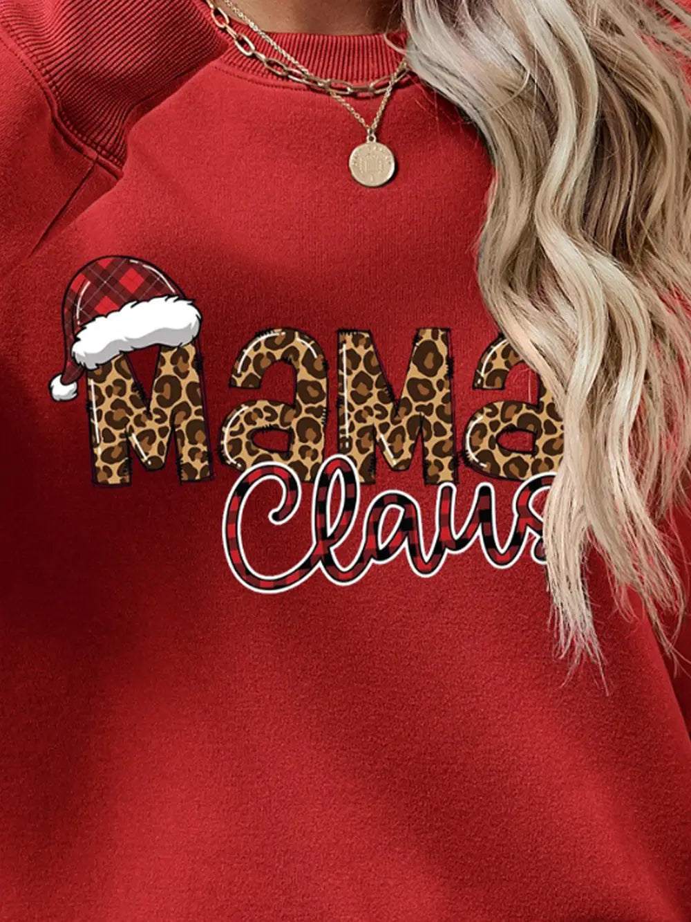 Red crewneck sweatshirt with leopard print "Mama" and plaid "Claus" text, featuring a Santa hat detail.