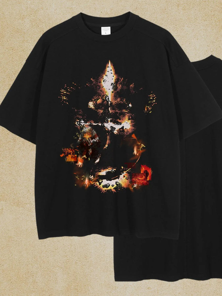 Black oversized t-shirt with an abstract fiery graphic print on the front.