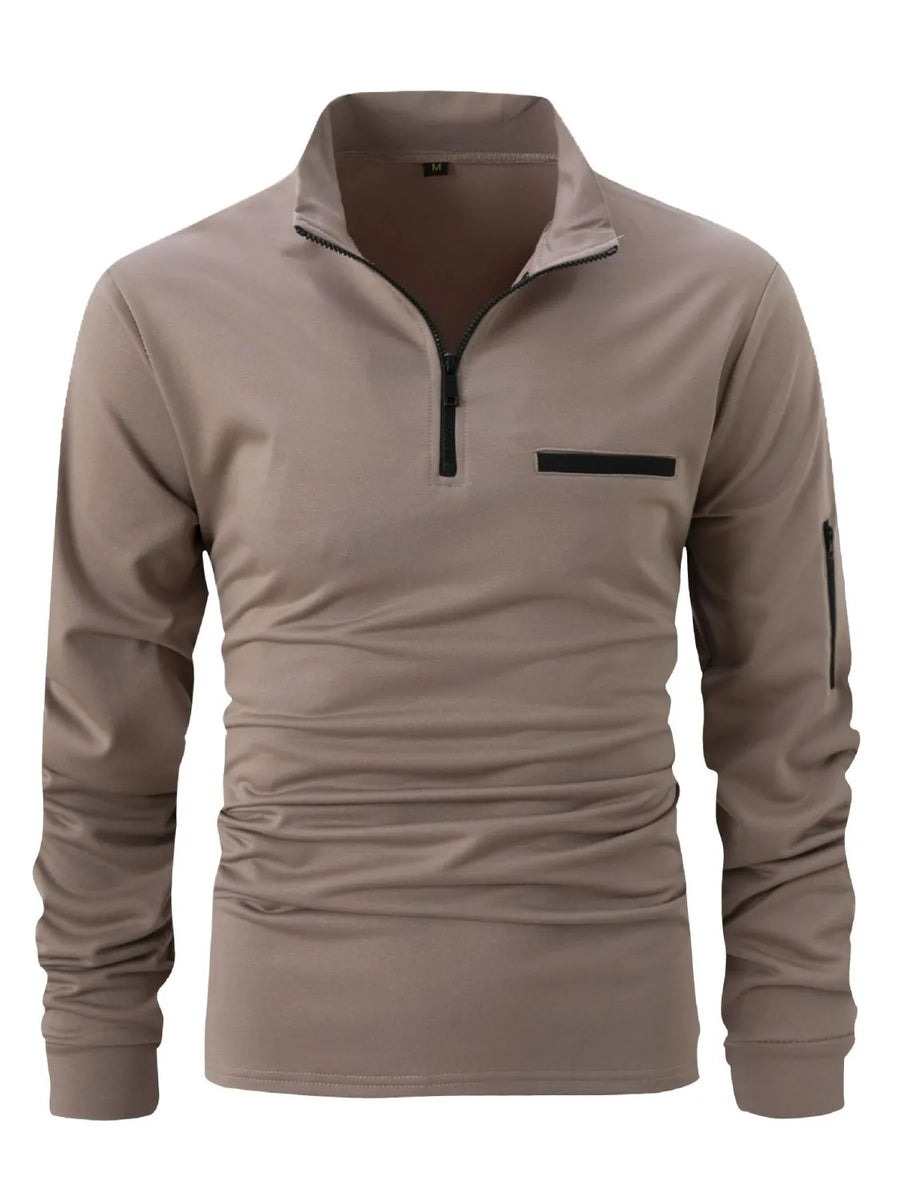 Mock neck zip-up sweatshirt in taupe with welt pocket and zippered sleeve pocket.