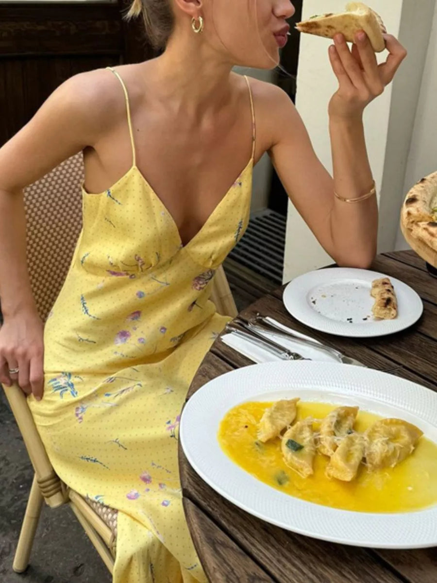 Yellow floral print slip dress with polka dots and spaghetti straps.