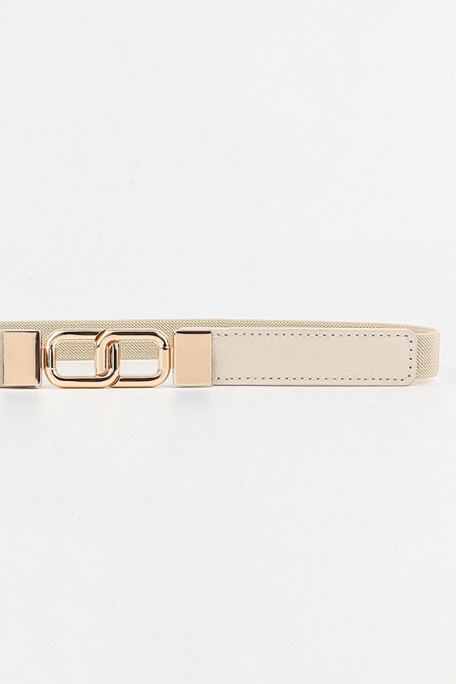 Cream elastic belt with linked gold rectangle buckle and faux leather detail.