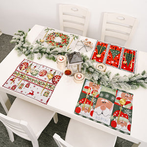 Embroidered Christmas placemats: Santa, Wreath, Tree, Reindeer designs with festive scenes.