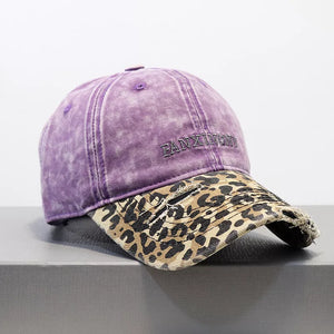 Purple distressed baseball hat with leopard print brim and frayed details