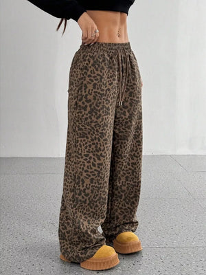 black wide-leg pants featuring drawstring waist and leopard-print