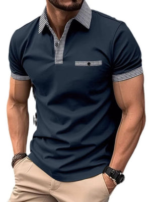 Navy polo shirt with gingham collar, pocket trim, and sleeve cuffs.