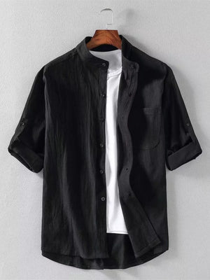 Black band collar button-up shirt with rolled sleeves and chest pocket.
