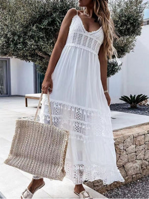 White crochet cami dress with tiered lace and tassel trim, V-neck, spaghetti straps.
