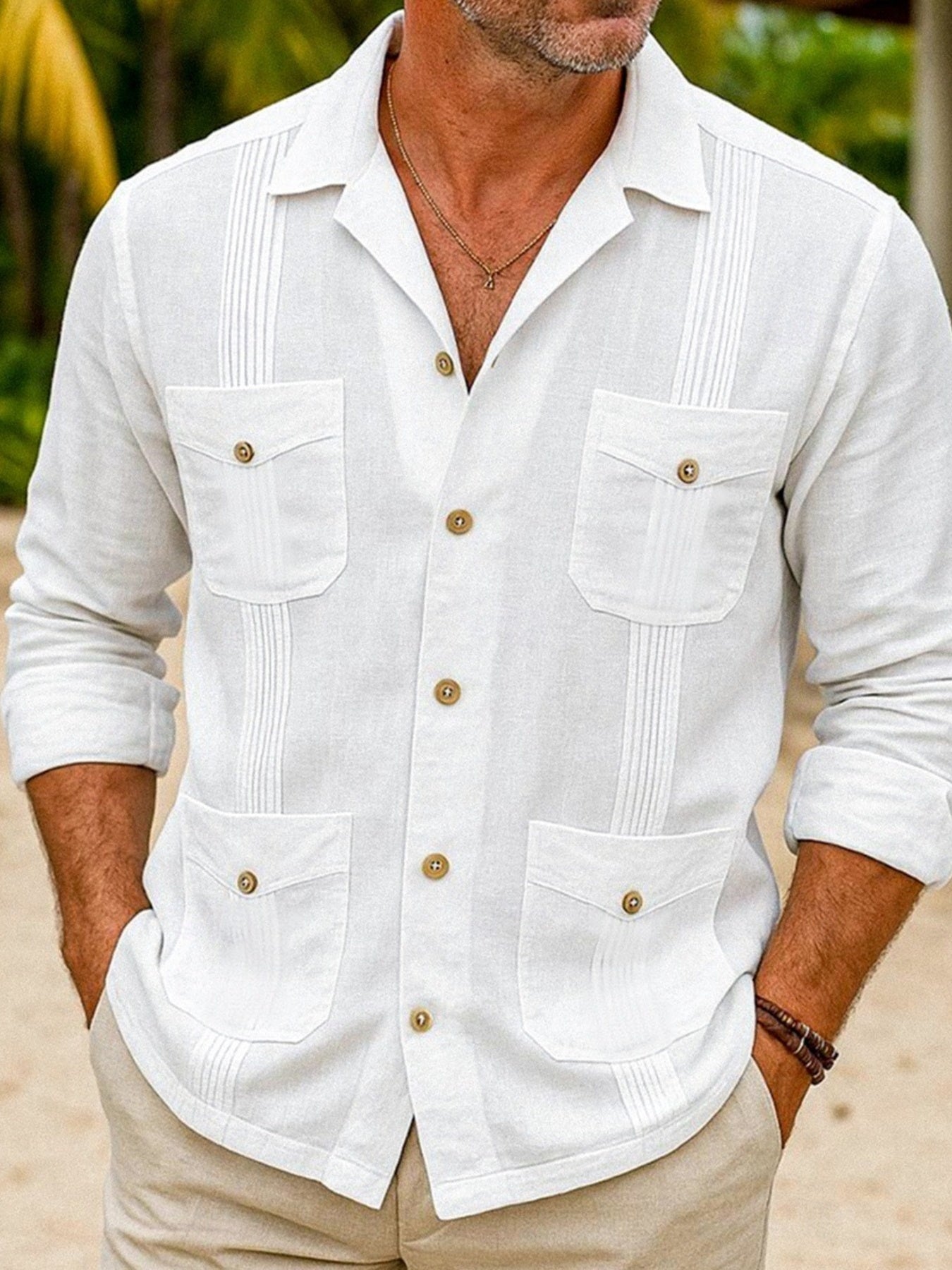 Men's white long sleeve button-up shirt with four pockets and pintuck details.