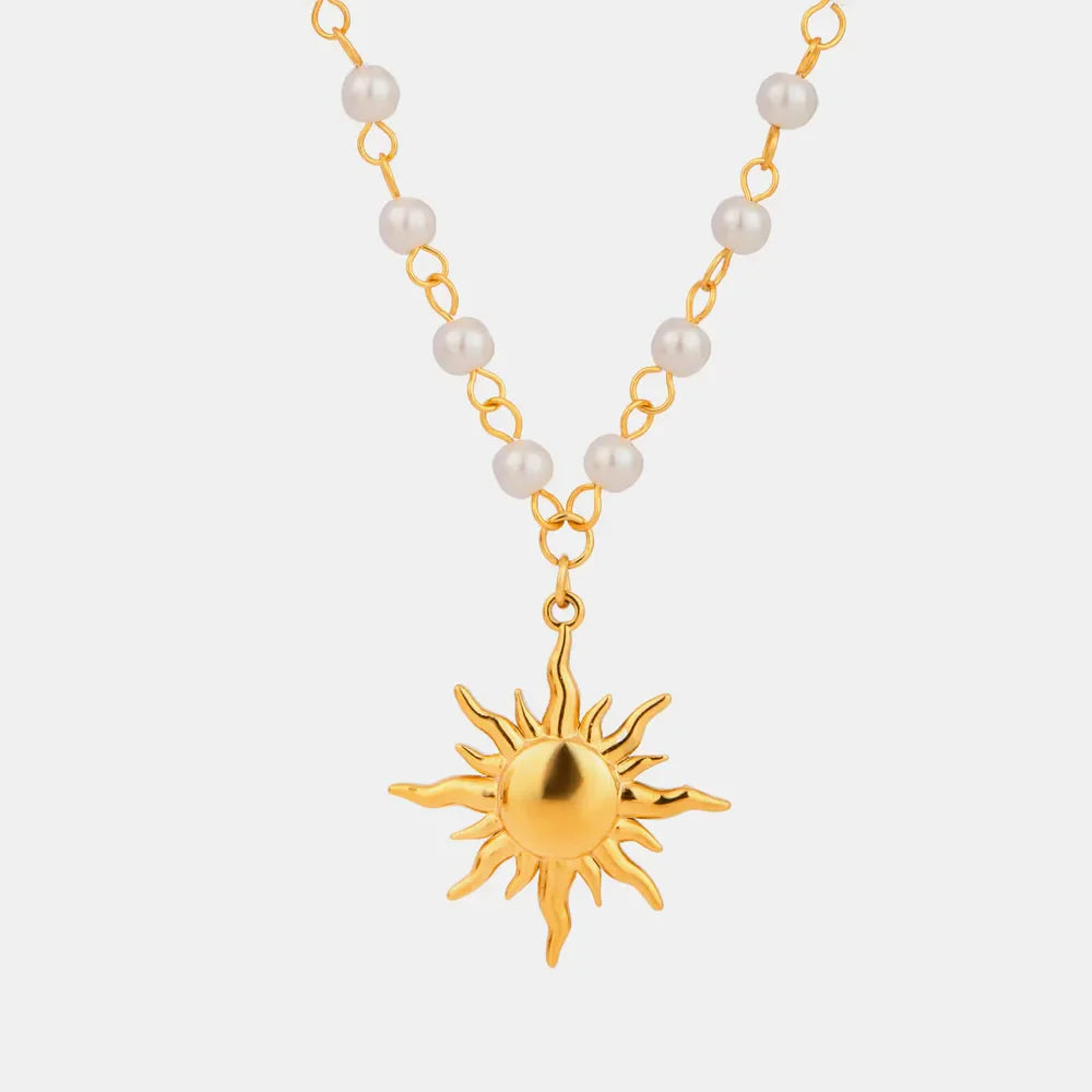 Gold celestial sun pendant necklace with pearl accents