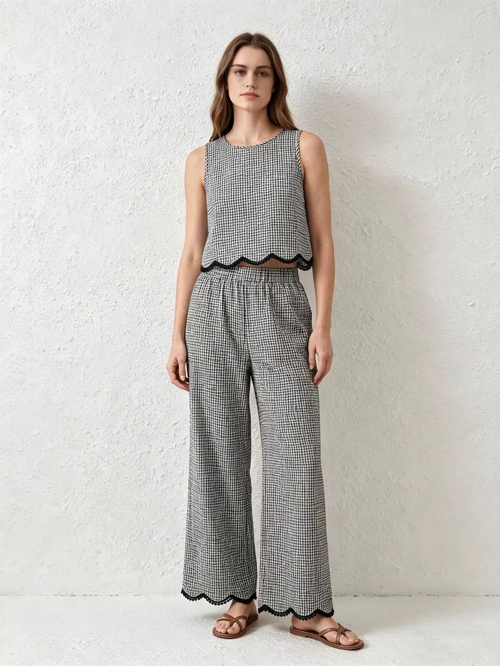 Plaid two-piece set with scalloped trim, featuring a sleeveless crop top and wide-leg pants.