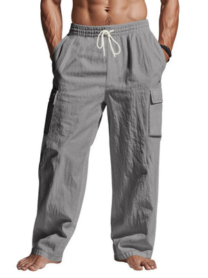 Relaxed-fit dark gray cargo pants with drawstring and side pockets.