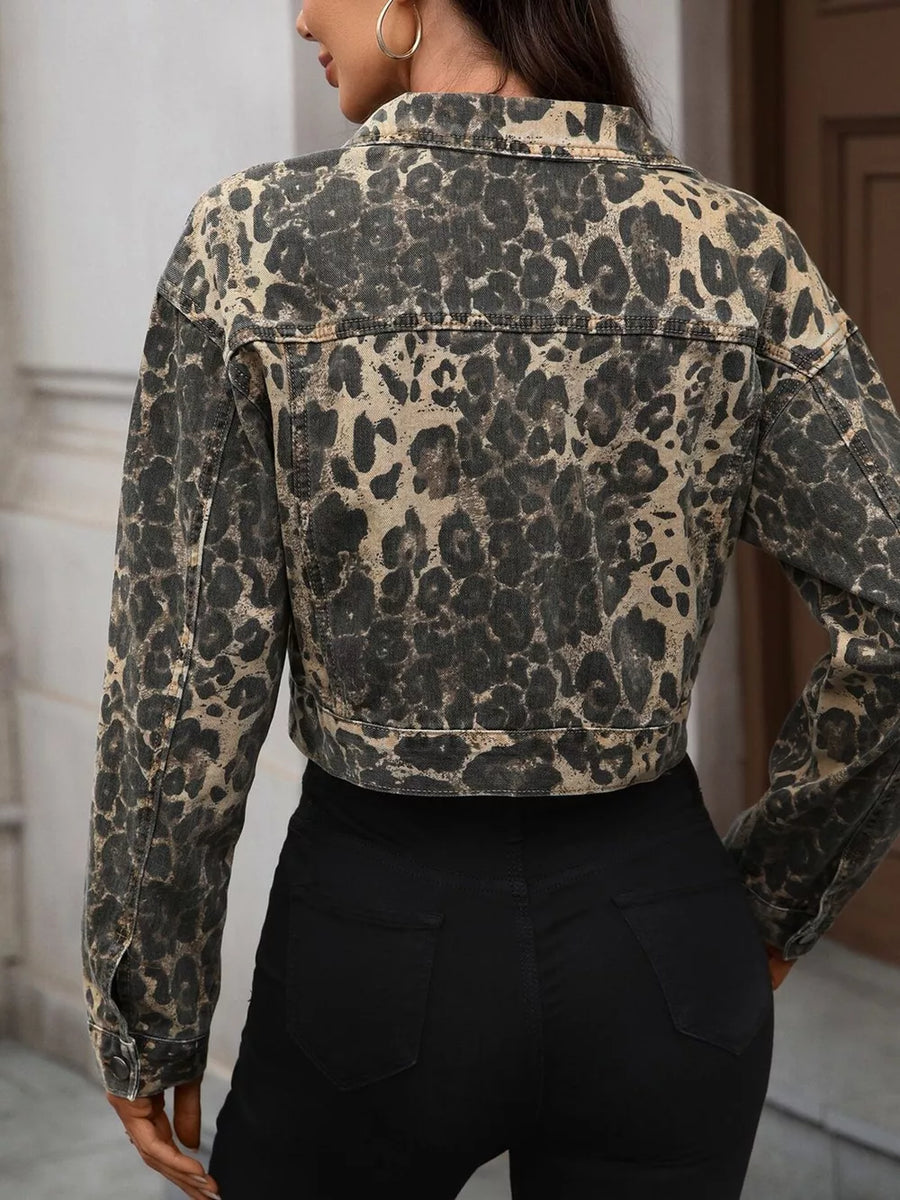 Leopard print cropped denim trucker jacket with button cuffs and collar.