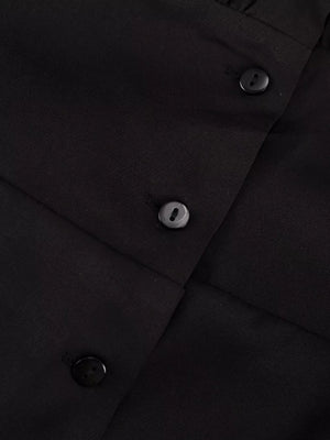 Black button-up blouse with textured fabric and dark buttons.
