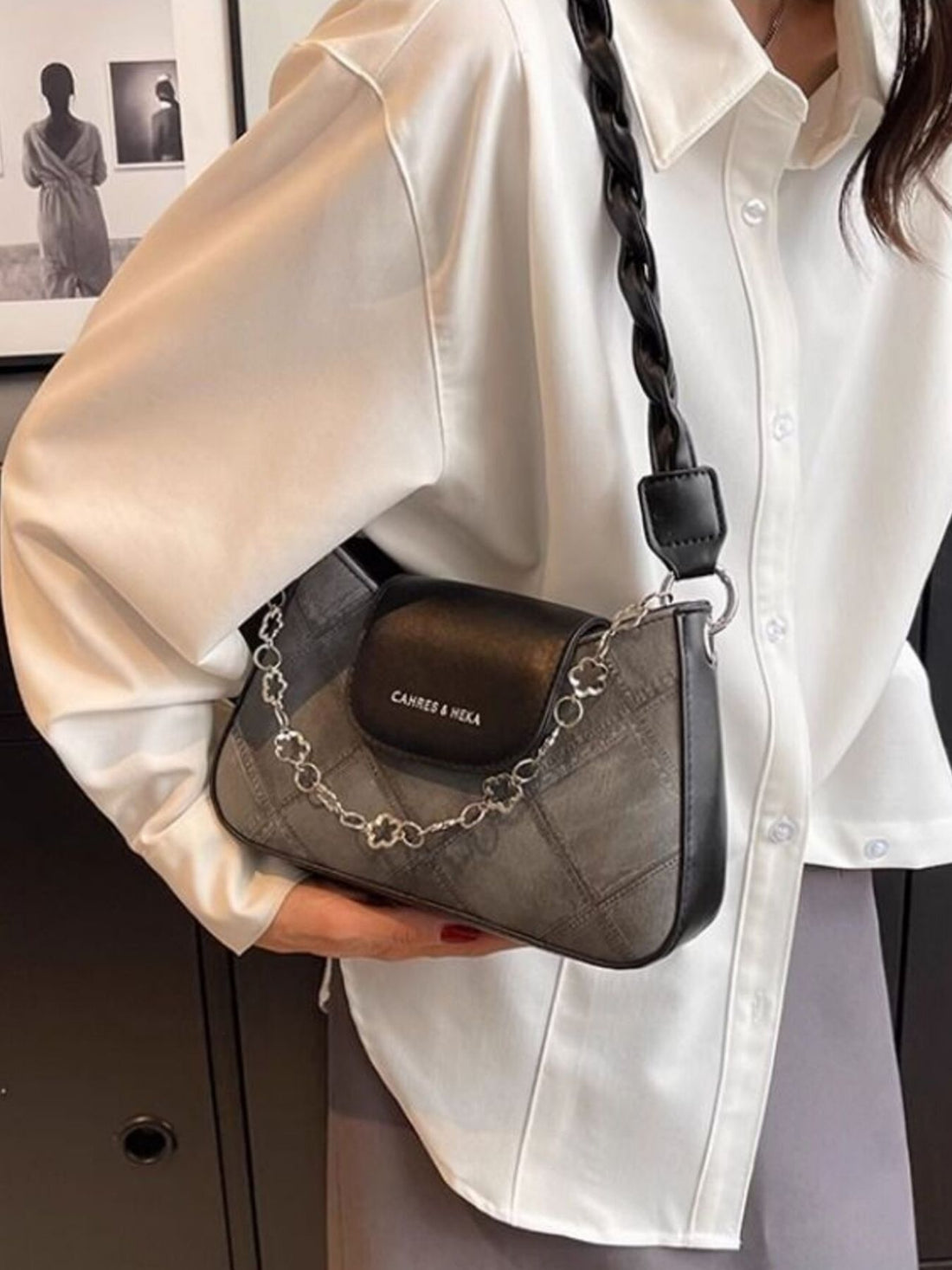 Textured leather shoulder bag with chain strap and braided detail