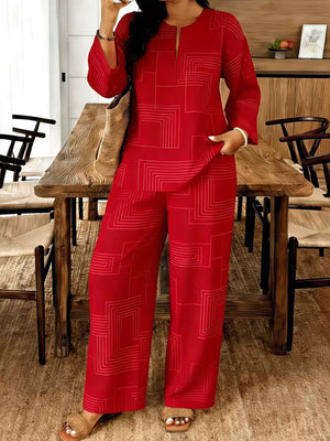 Red geometric print wide-leg pants and matching long-sleeve top with notch neckline.