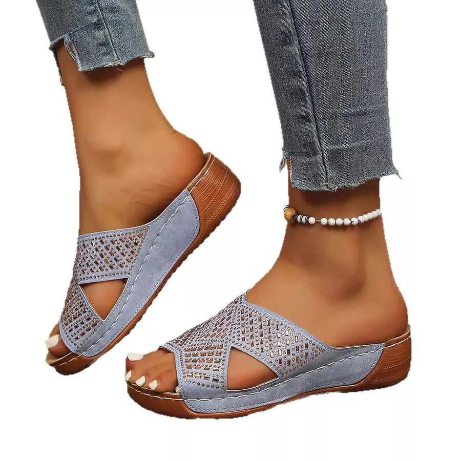 Sky blue rhinestone-embellished open toe wedge sandals with criss-cross straps.