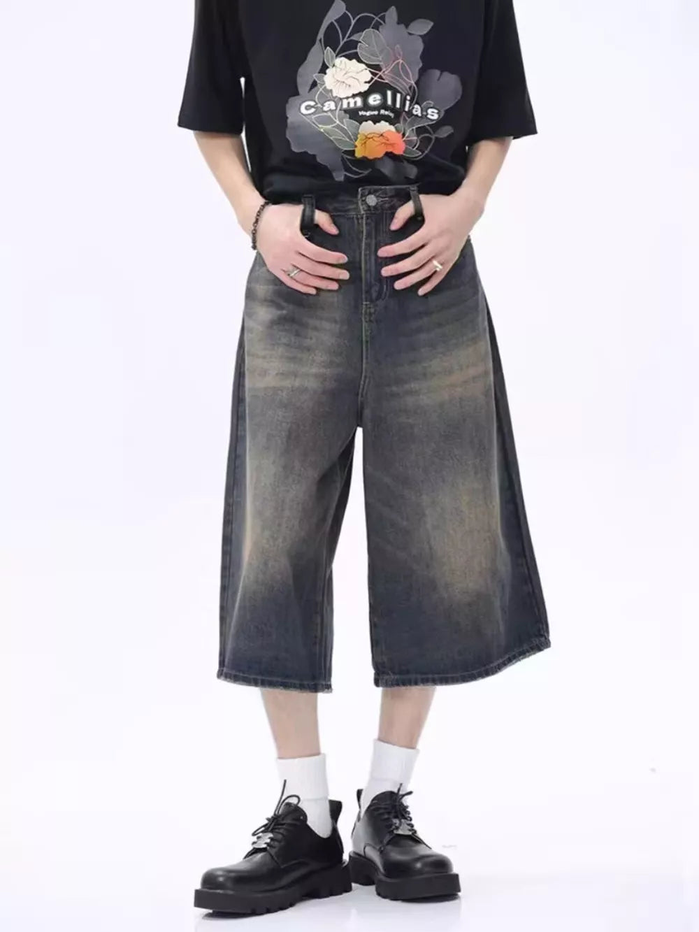 Vintage wash wide-leg denim culotte shorts in dark gray with a relaxed fit.