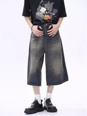 Vintage wash wide-leg denim culotte shorts in dark gray with a relaxed fit.