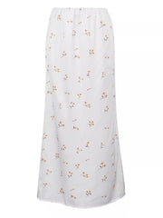White maxi skirt with a delicate yellow floral print and elastic waist