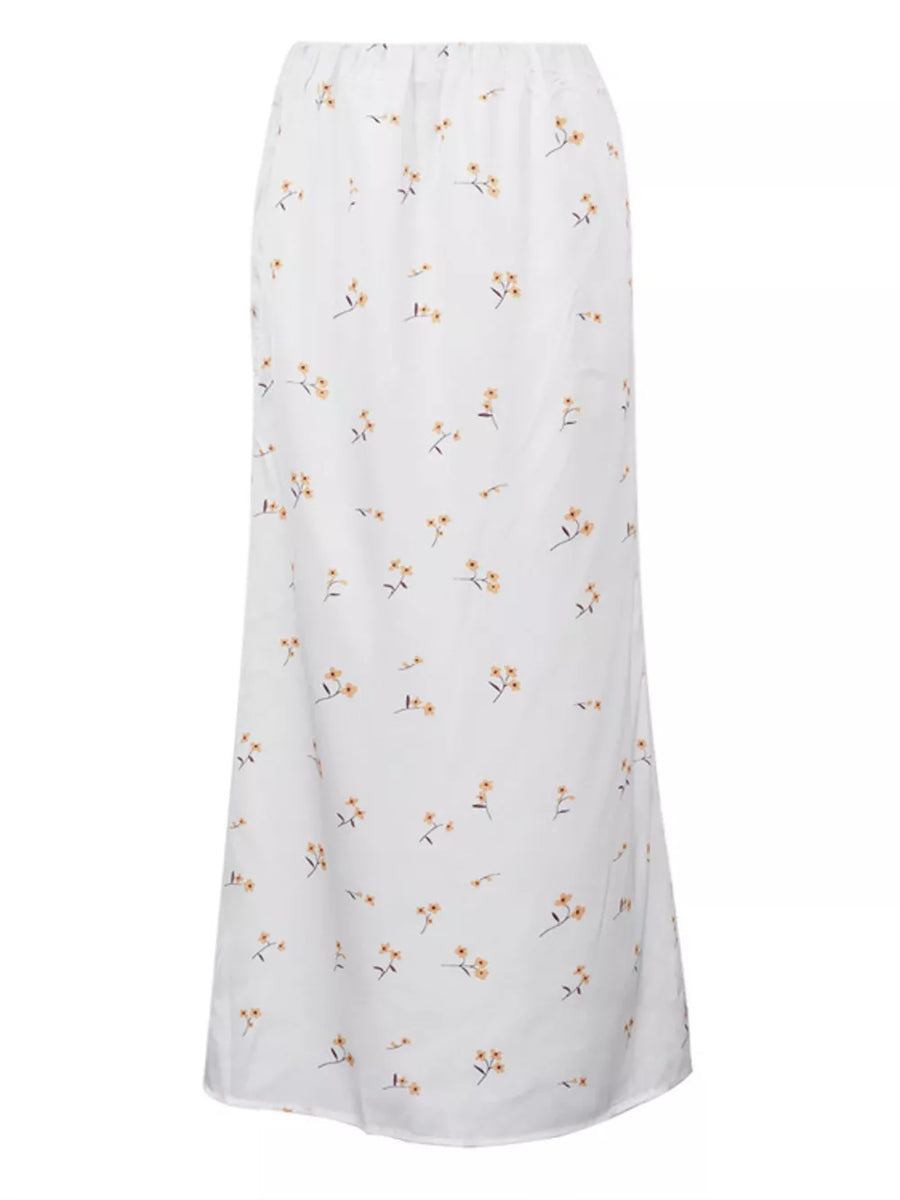 White maxi skirt with a delicate yellow floral print and elastic waist