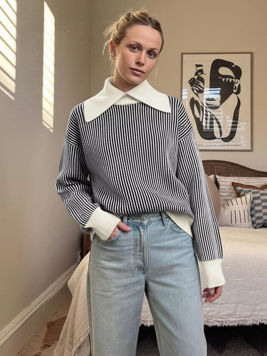 Black and white striped knit sweater with a contrast white collar and cuffs.