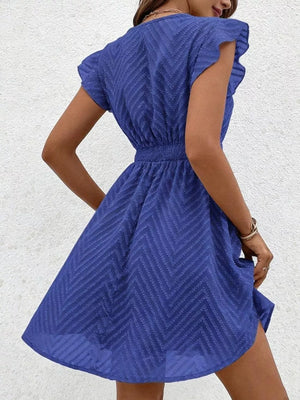Royal blue chevron textured V-neck mini dress with defined waist and flutter sleeves.
